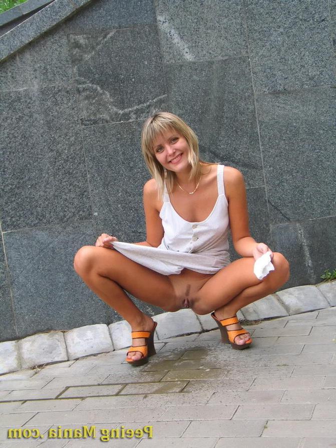 15P Playful blondie has wonderful time making a piss on the stony pavement