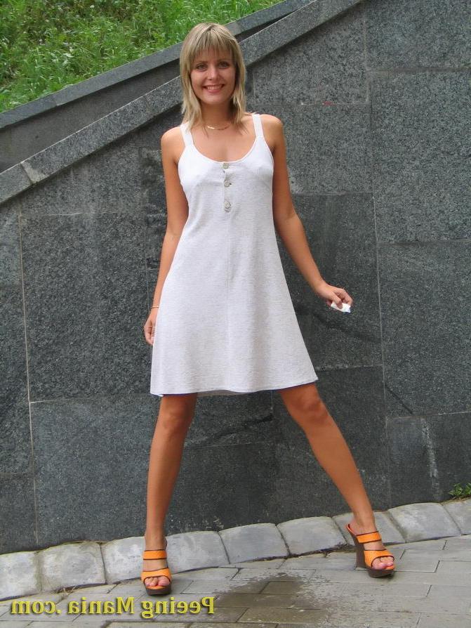 15P Playful blondie has wonderful time making a piss on the stony pavement