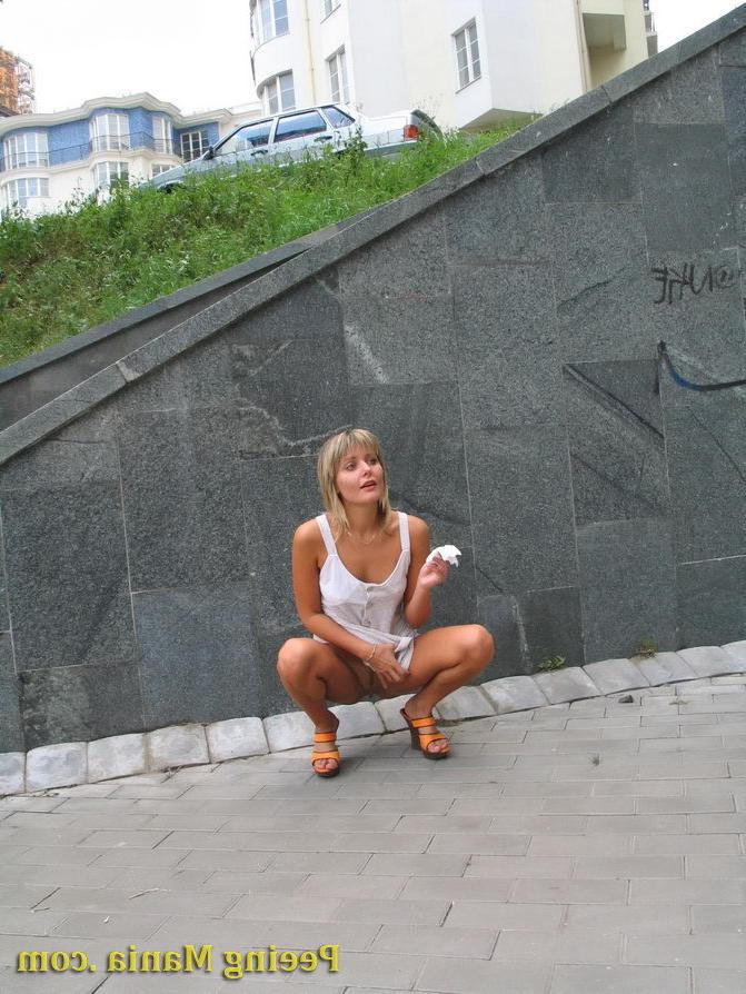 15P Playful blondie has wonderful time making a piss on the stony pavement