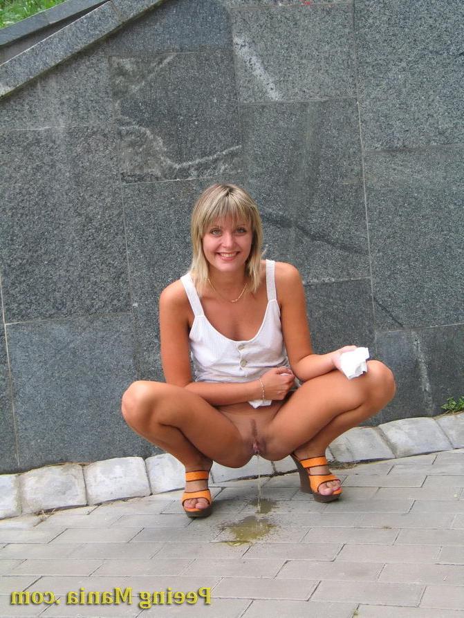 15P Playful blondie has wonderful time making a piss on the stony pavement