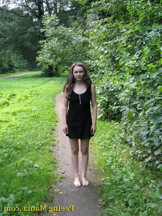 15P Cute gal lays bare her pussy and shows her pissing talents in the park