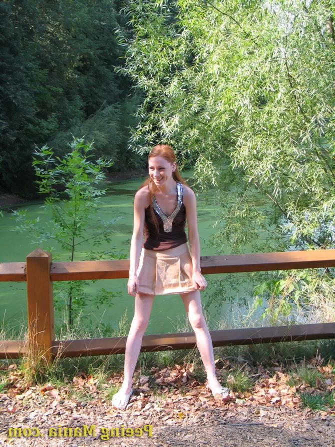 15P Jolly chickie lifts her skirt up and has a pee standing on the bridge