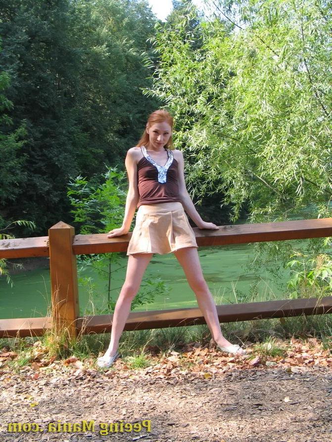 15P Jolly chickie lifts her skirt up and has a pee standing on the bridge
