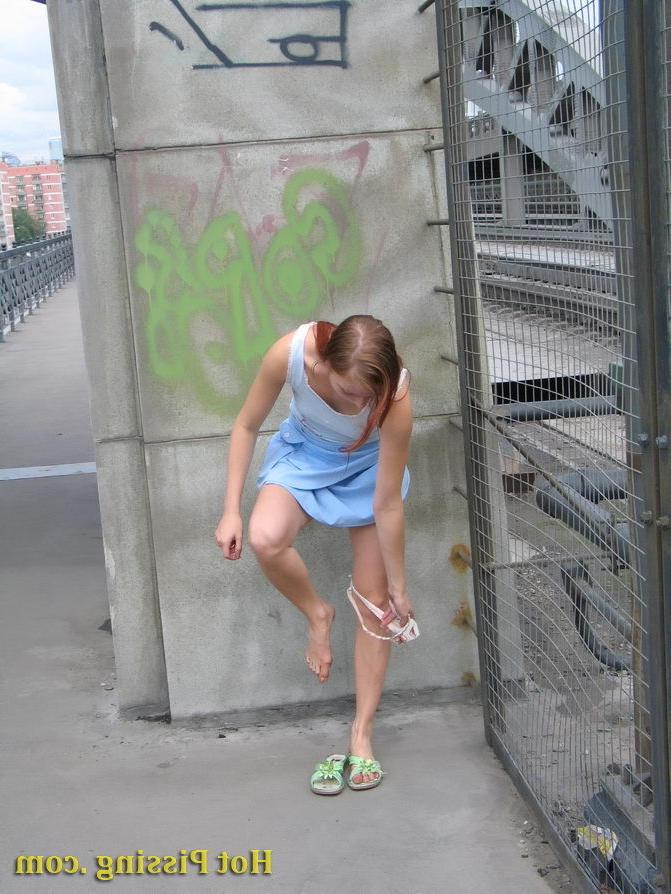 15P Naked spread legs and sweet pussy of a lovely girl piddling outdoors