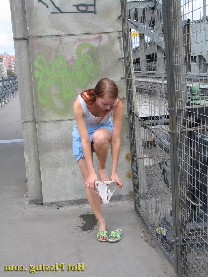 15P Naked spread legs and sweet pussy of a lovely girl piddling outdoors