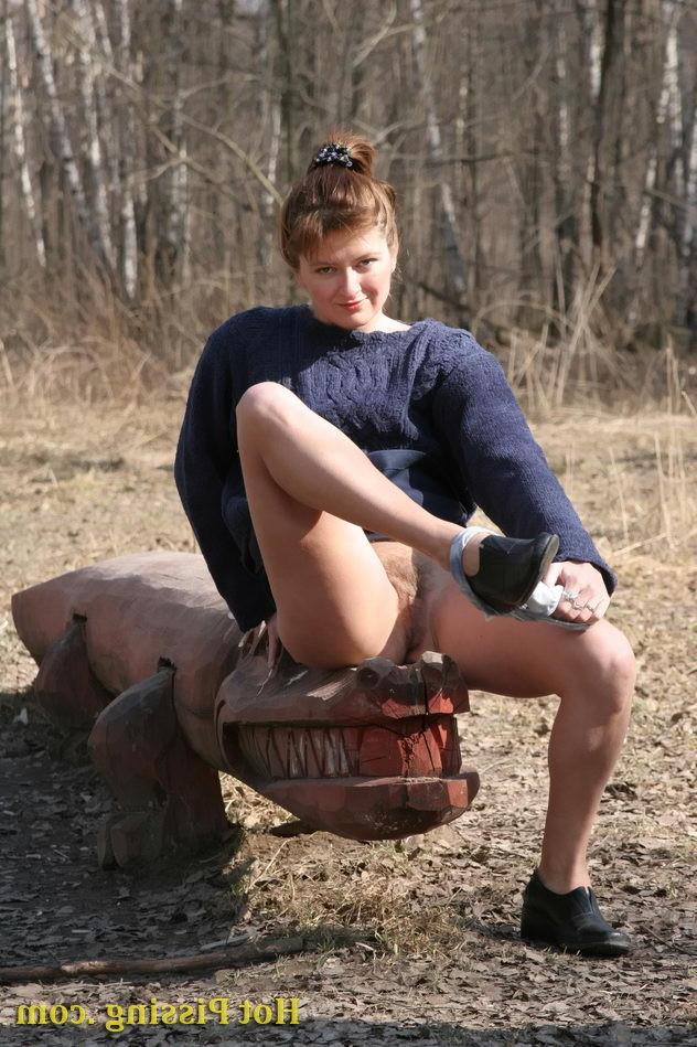 15P Creative hot chickie doing a pee in the lying position in the open air