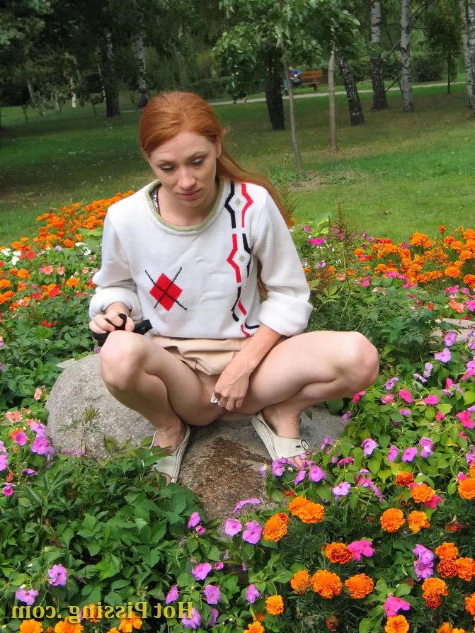 15P Naughty wench squats in the middle of a flowerbed and makes a pee-pee