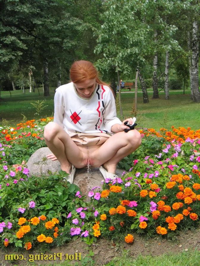 15P Naughty wench squats in the middle of a flowerbed and makes a pee-pee