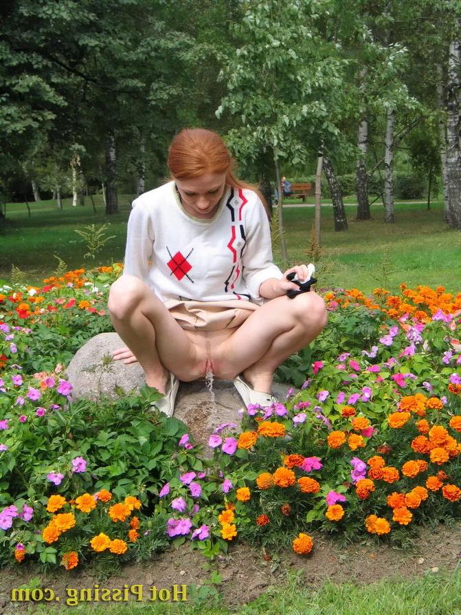 15P Naughty wench squats in the middle of a flowerbed and makes a pee-pee