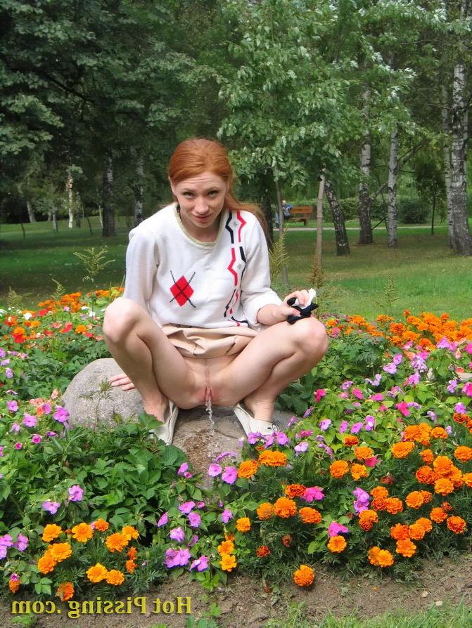 15P Naughty wench squats in the middle of a flowerbed and makes a pee-pee
