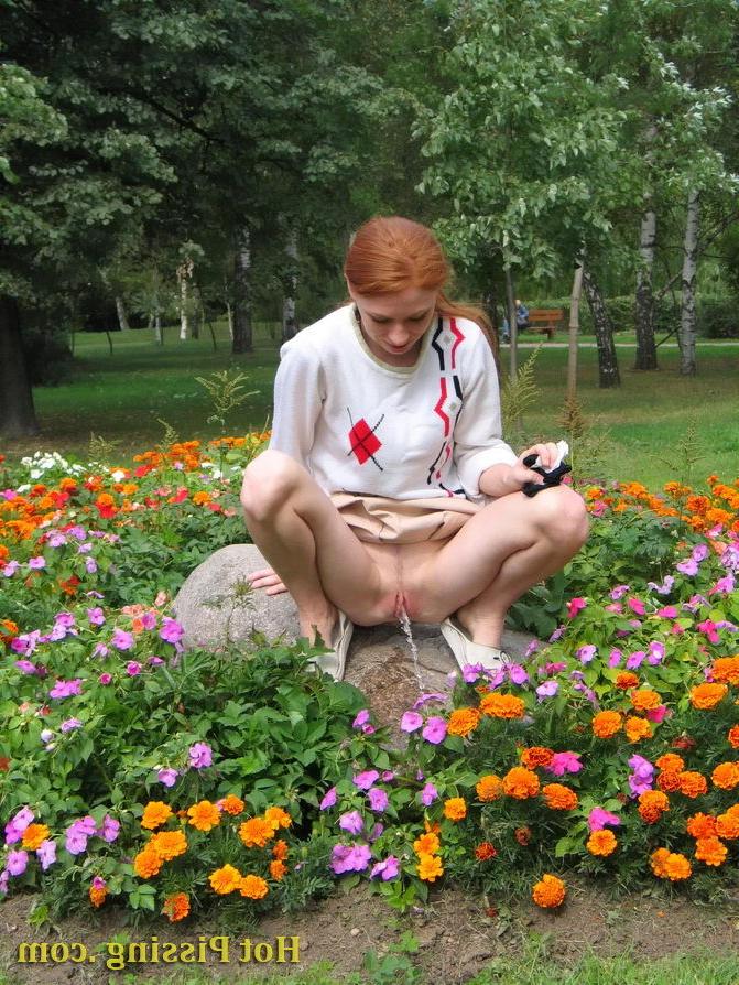 15P Naughty wench squats in the middle of a flowerbed and makes a pee-pee