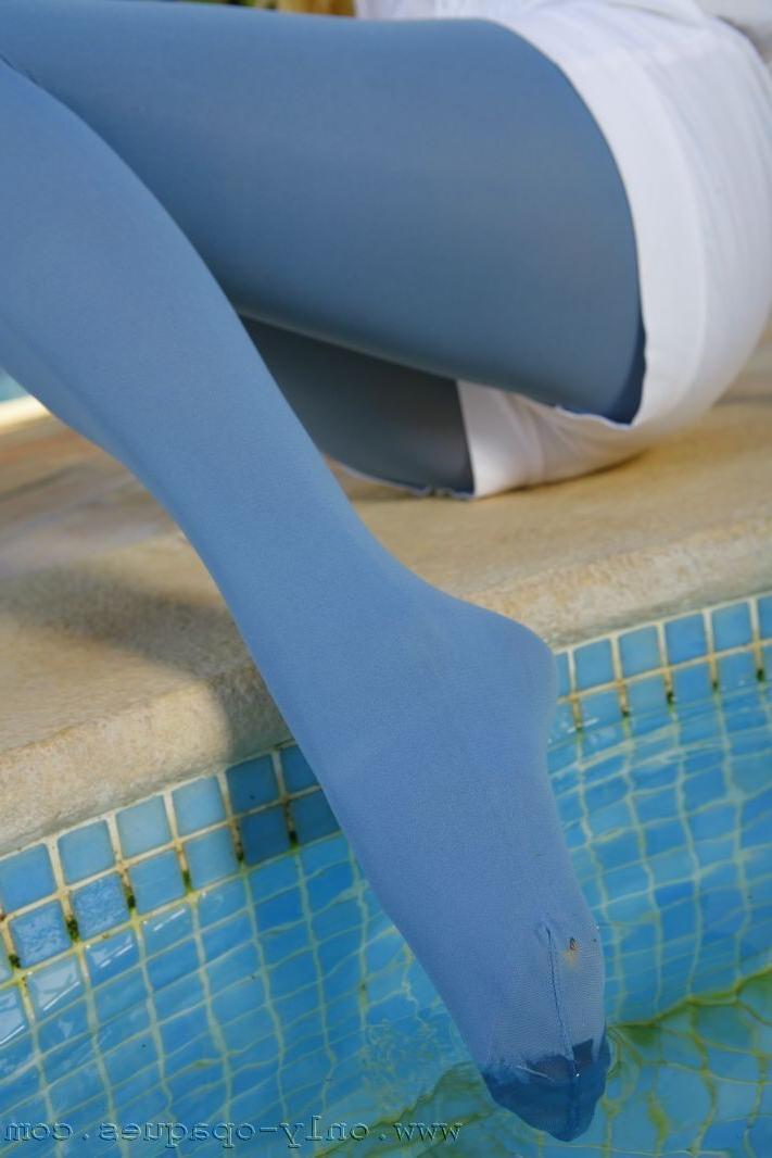 15P Petite blonde in pantyhose gets into the pool for wet nylon fun