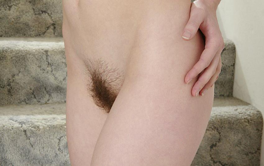 20P Cutie spreads hairy pussy on stairs