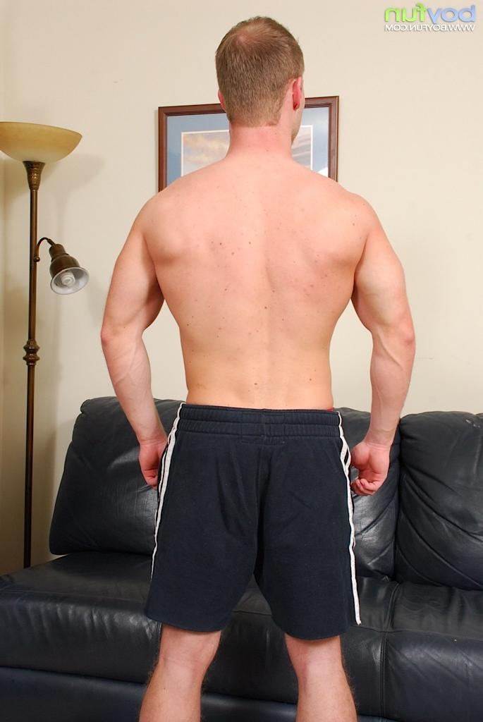 15P Tyler Andrews lying butt naked on the leather sofa