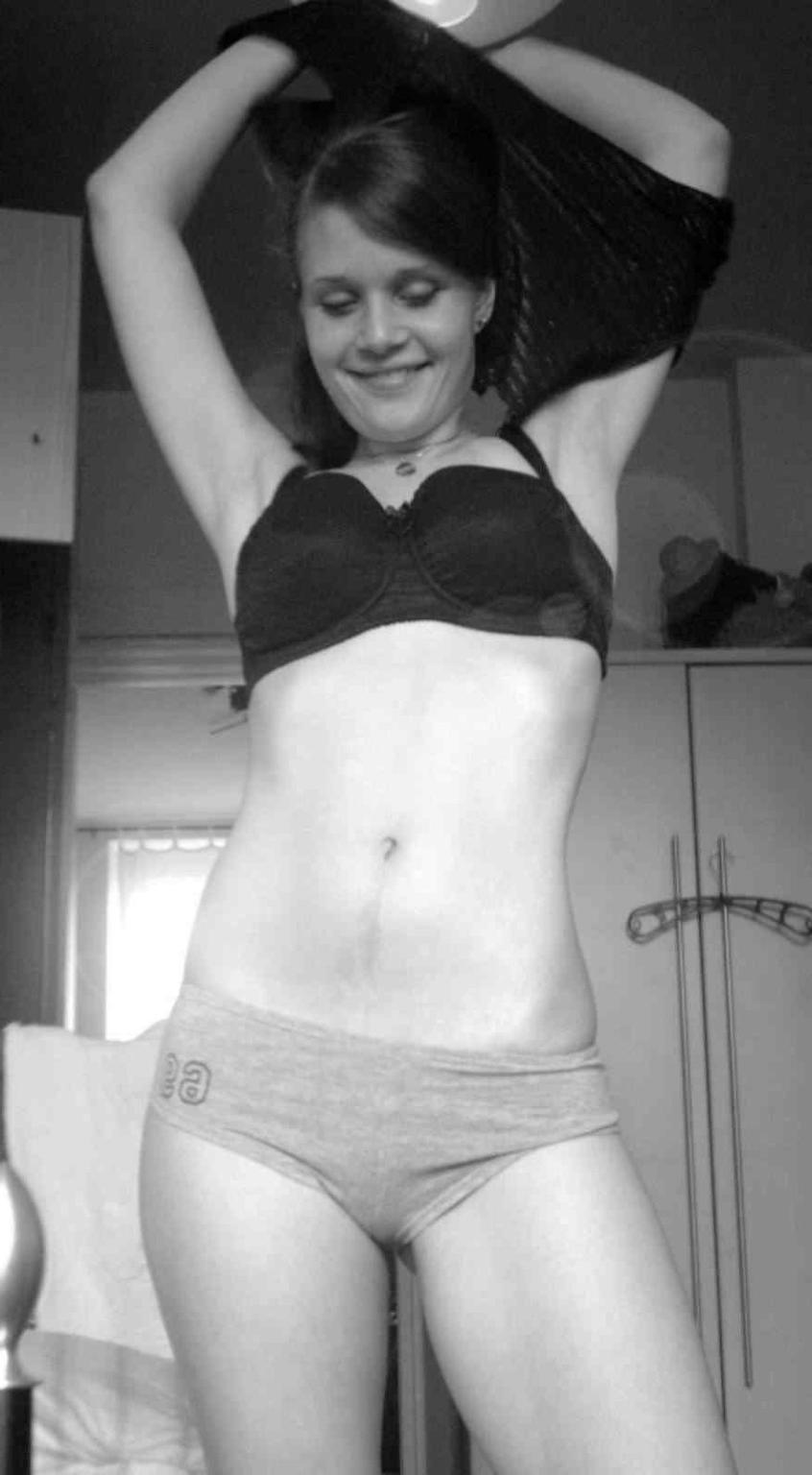 16P Coed babe poses and masturbates with a dildo in her bed without taking off her p