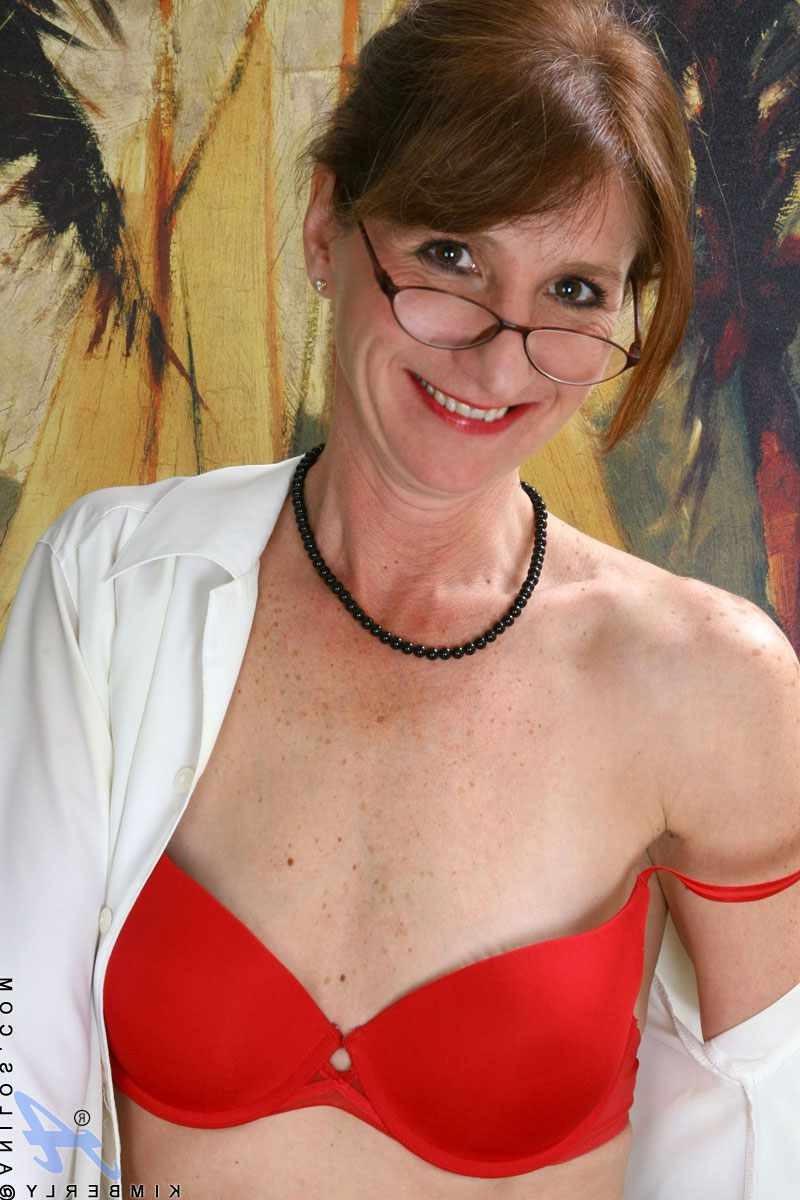 15P Mature secretary wearing glasses stripping