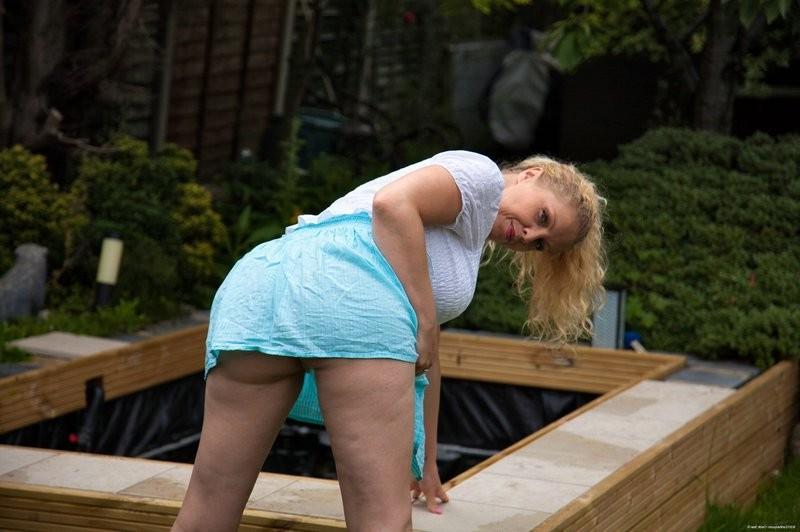 15P Blonde Milf Teya exposes her naturals outdoors