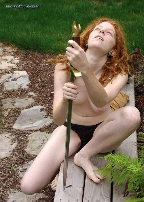 15P Redhead Nudist With Flaming Red Hairy Pussy Plays With Sword
