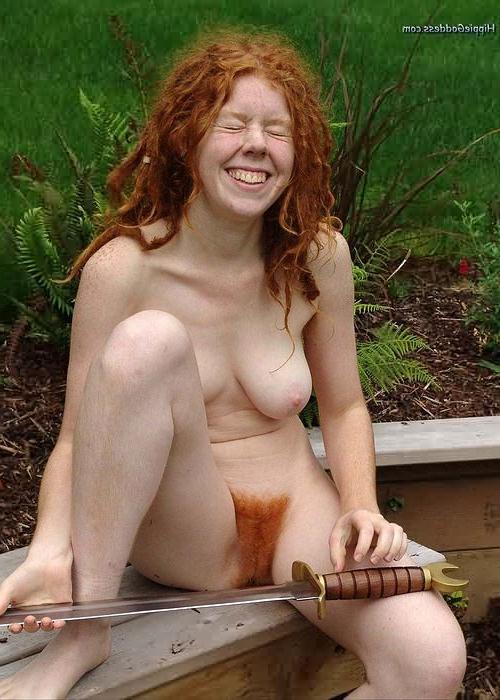 15P Redhead Nudist With Flaming Red Hairy Pussy Plays With Sword
