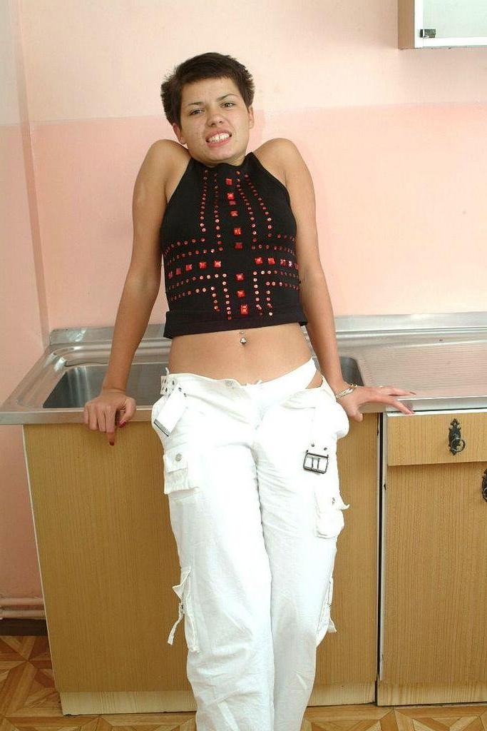 20P Naked hairy pussy teen teasing and posing in the kitchen