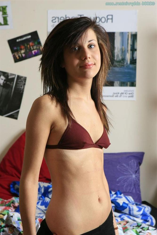 16P Amateur brunette strips naked and spreads her hairy pussy