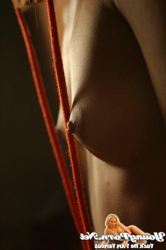 15P Young lady showing her tiny tits