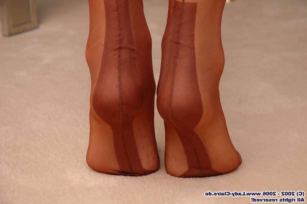15P Mature redhead lady Claire undressing brown stockings