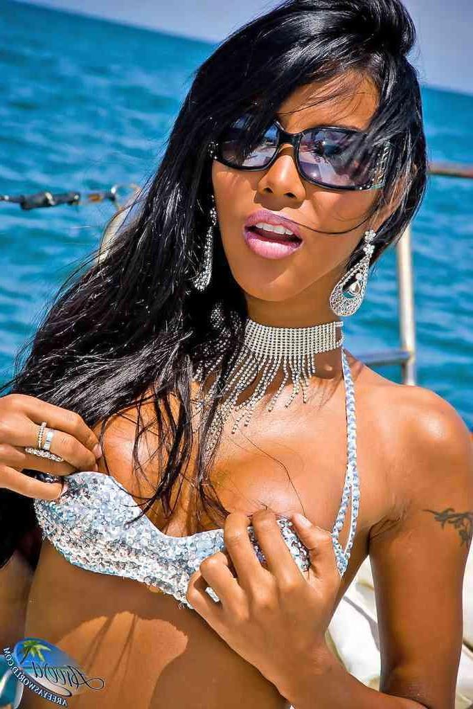 16P Gorgeous shemale in a bikini on a boat