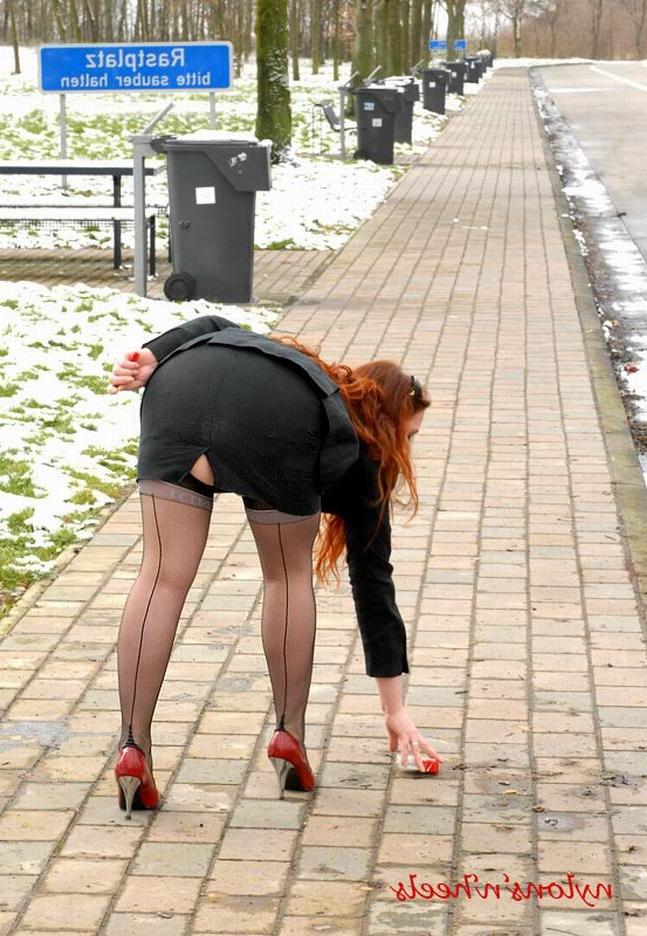 12P Redhead Justine with sexy stockinged legs in red high heels