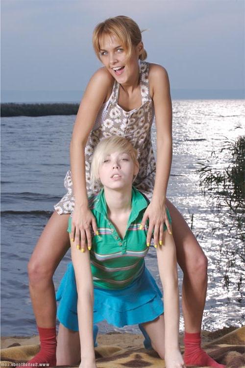17P Two young delicious lezzies teasing in passion on the sea shore