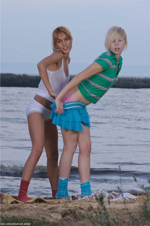 17P Two young delicious lezzies teasing in passion on the sea shore
