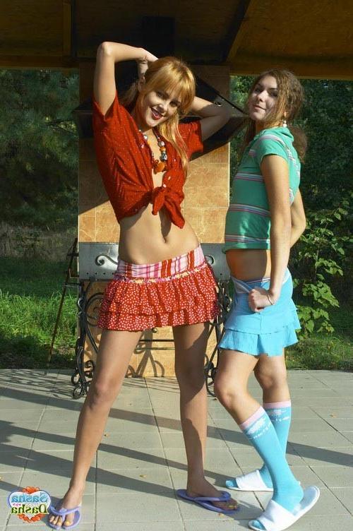 17P Two outstanding young lesbians stripping and teasing outdoors