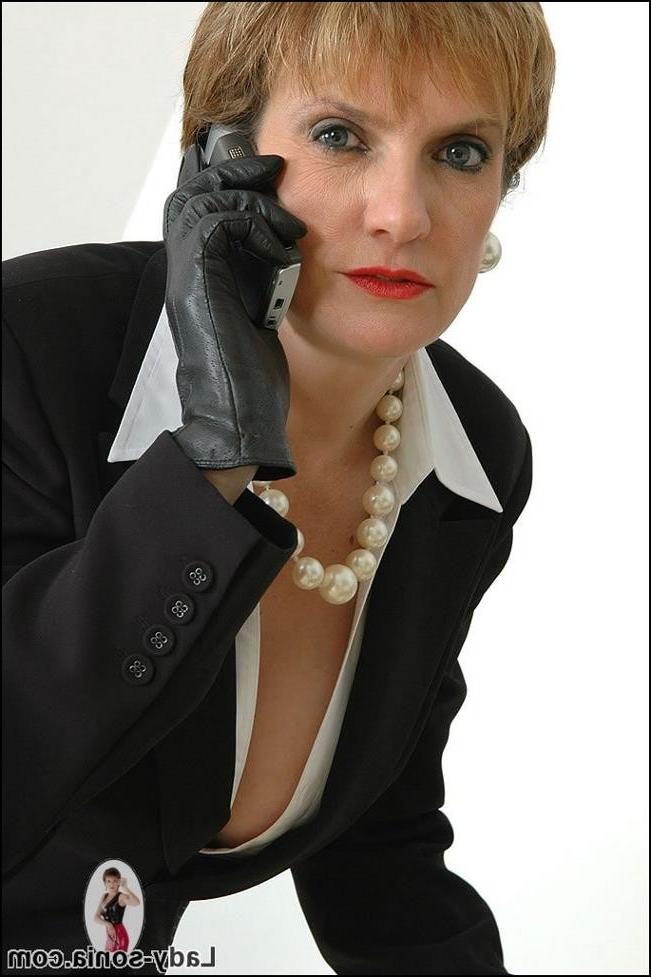 15P Mature business woman in stockings and high heels gives bj