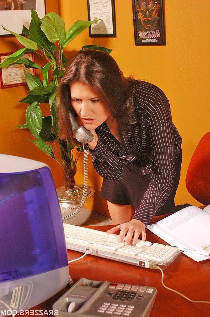 15P Busty office girl Austin Kincaid needs help with her computer