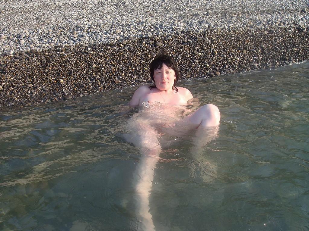 15P Nudist tanning on the beach