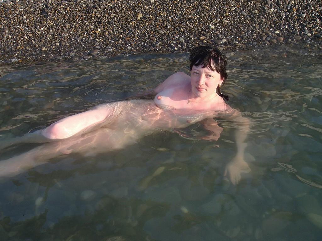 15P Nudist tanning on the beach