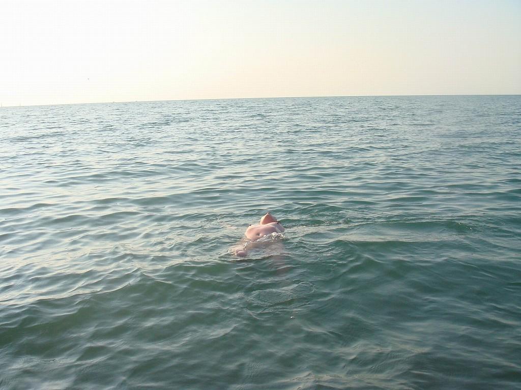 15P Nudist tanning on the beach