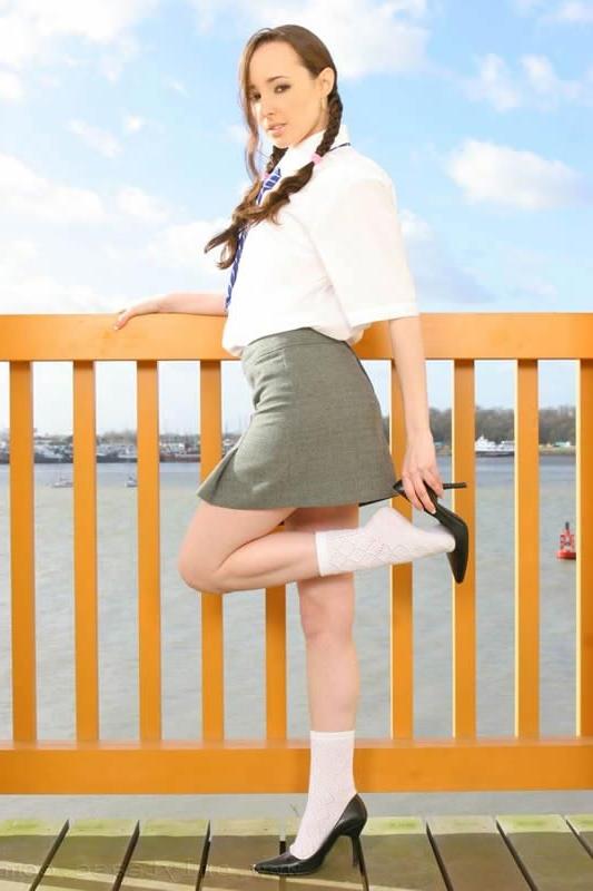 15P This brunette schoolgirl strips outdoors