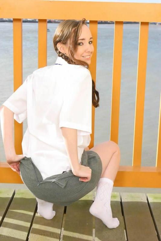 15P This brunette schoolgirl strips outdoors