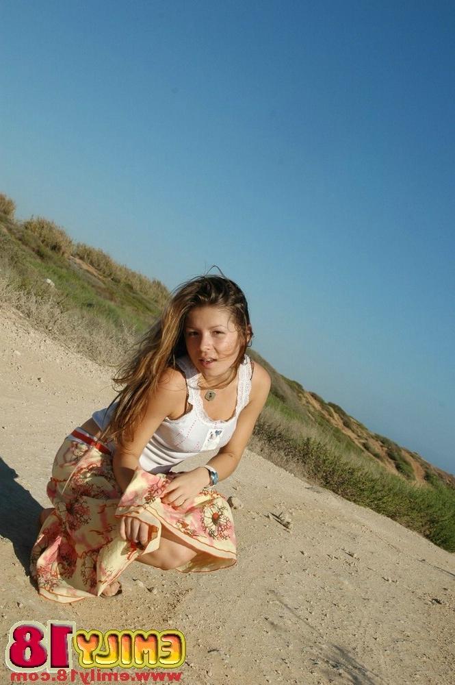 15P Young chick emily stripping at the beach