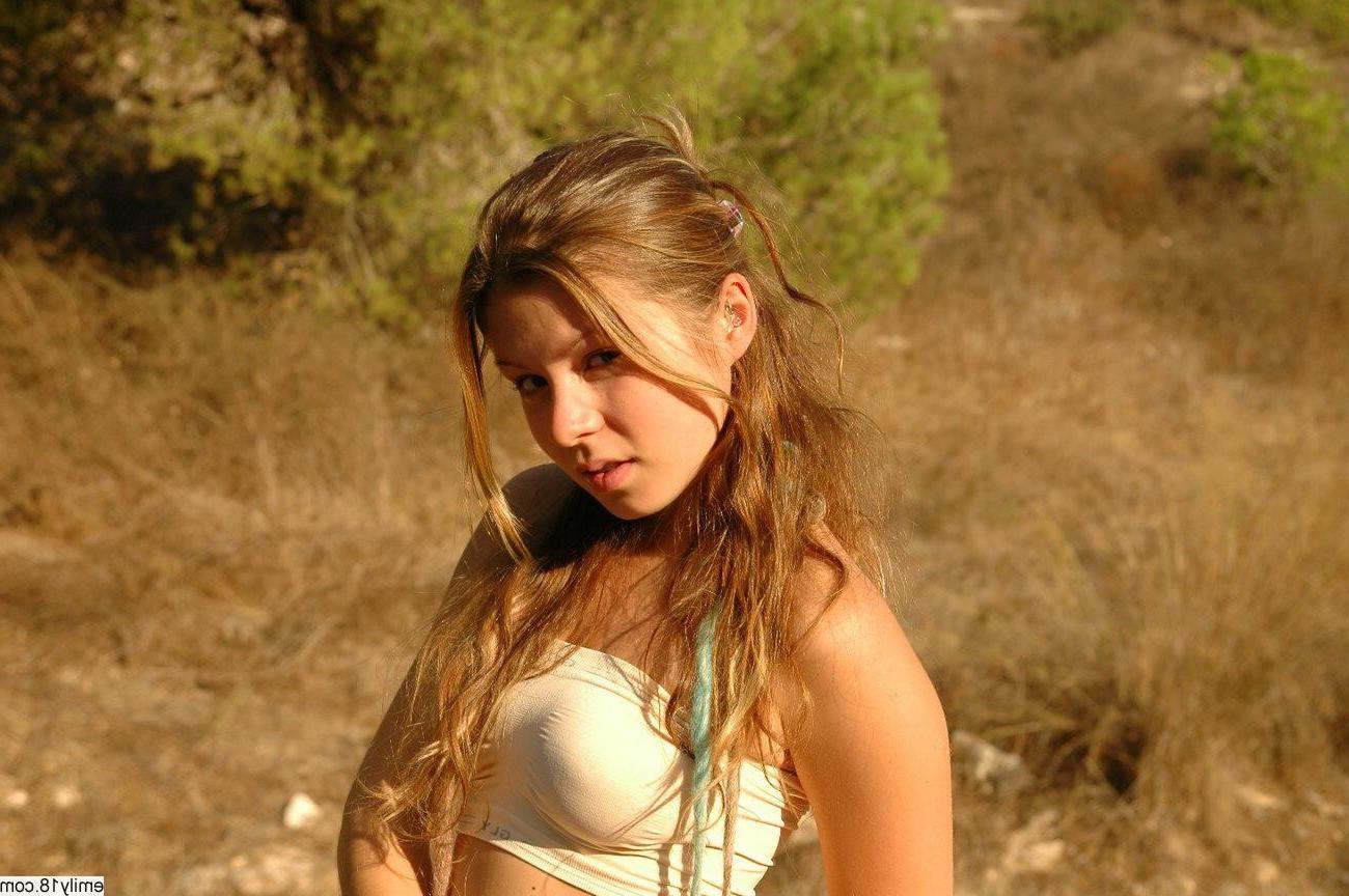 14P Young Emily showing her tits outside in the sand