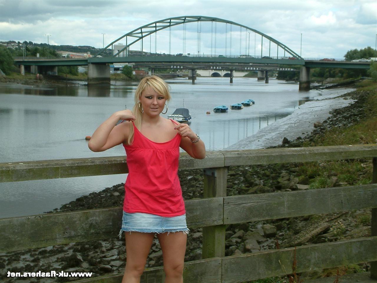 16P Busty teen blonde flashing and playing with pussy in public by a bridge in the m