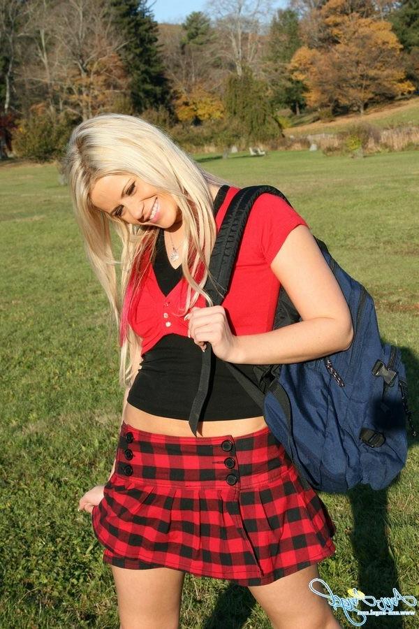 15P Busty Anna Angel in a tight red schoolgirl outfit outdoors