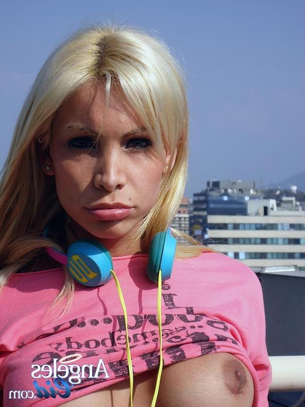 15P Shemale Angeles Cid showing her big chubby cock on the roof