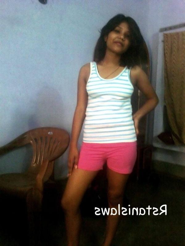 8P lady posing in stripped panty and bra showing hot figure.