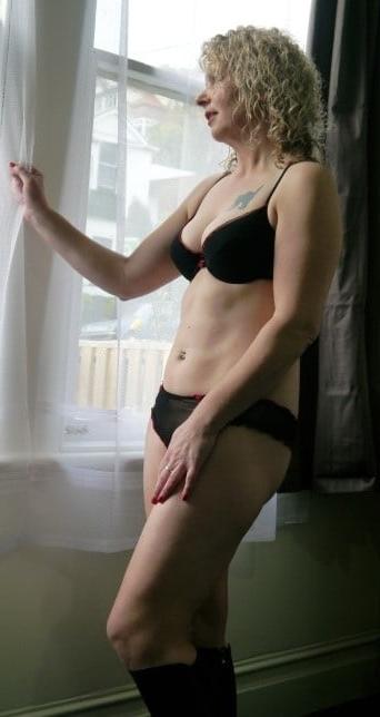 25P Matures standing in front of window 8
