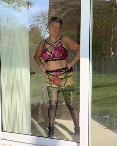 25P Matures standing in front of window 8