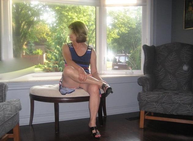 25P Matures standing in front of window 8