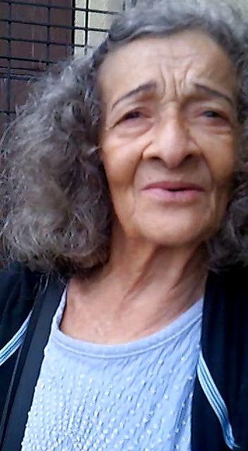13P Grandmother begging at the entrance of the church
