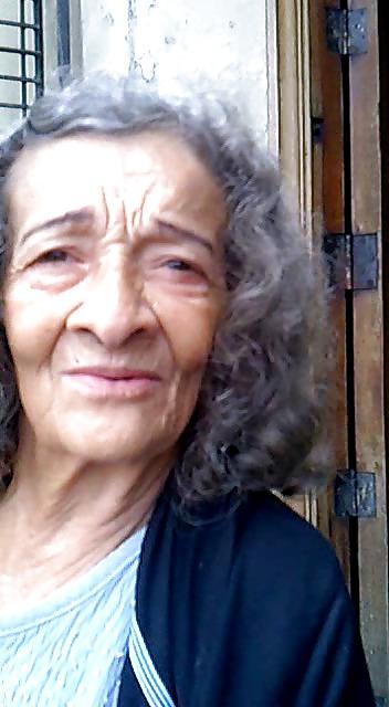 13P Grandmother begging at the entrance of the church